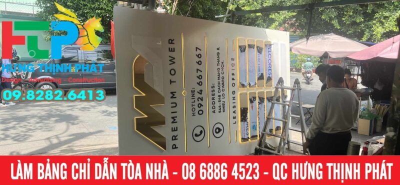 Bang chi dan toa nha bang inox vang sang led màu nang am